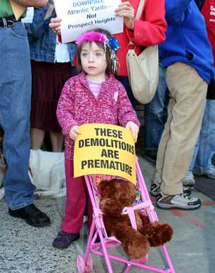 Ratner’s wrecking ball hits, protested