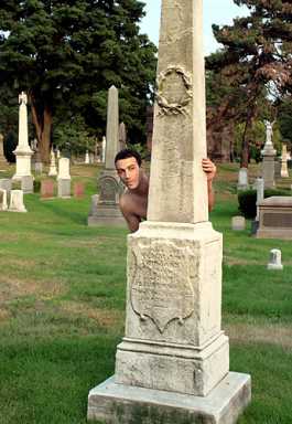 Snapping shots in the cemetery, naked