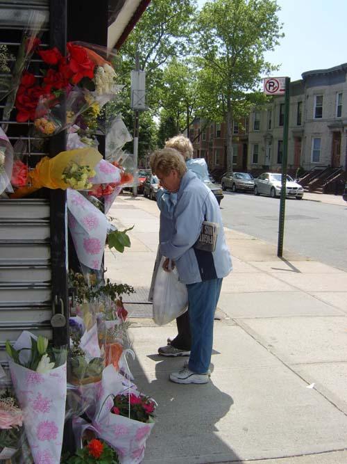 Cleaner’s murder sparks outpouring of grief – Many pay their last respects outside popular 10th Avenue shop