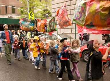 Students hold all the strings to puppet parade