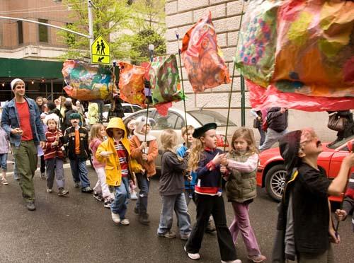 Students hold all the strings to puppet parade
