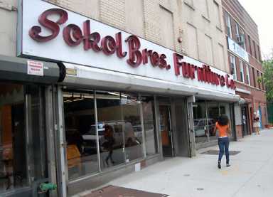 Big blue box doesn’t scare nearby mom-and-pop