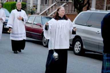 Parishioners march for the feast of Corpus Christi