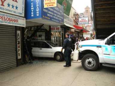 Car crashes through photo shop
