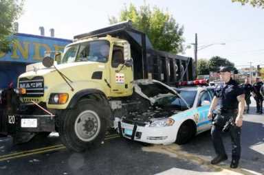 Cop car, DOT dumpster collide on Utica Avenue