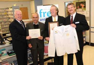 Pharmacists & friends-State Senator honors efforts to keep costs down