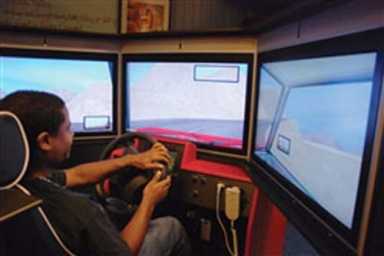 Buckled up in Belgium-Teenagers get behind the wheel of U.S. Army simulators
