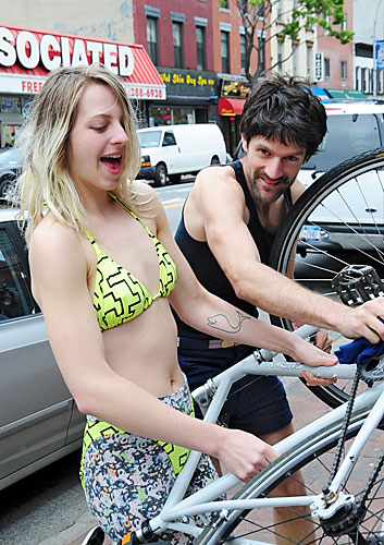 A woman in a bikini washed bikes