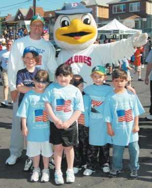 Youngsters lace up sneakers for annual 2âˆ’mile benefit run