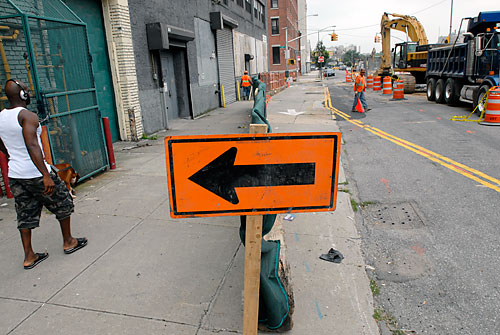 City sidewalk, busy sidewalk! Street pedestrian walkway is now a car lane!