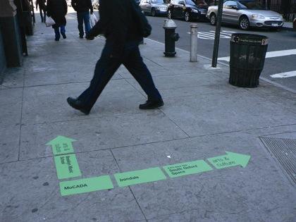 Sidewalk decals point way to Brooklyn
