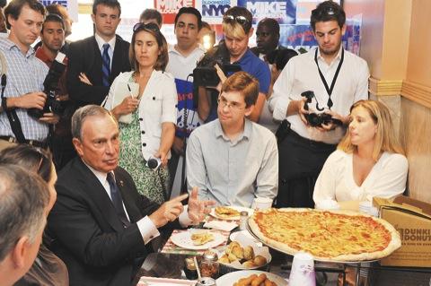 Mike breaks (pizza) bread with masses