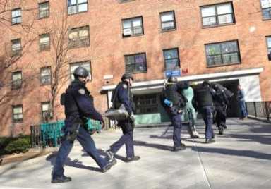 Cops charge housing project in wake of shooting