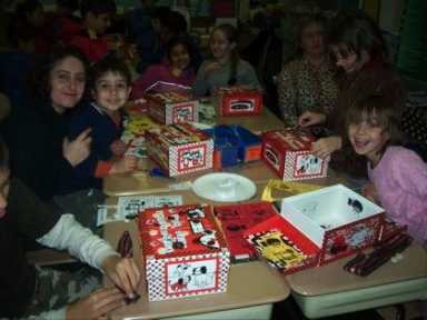 Families enjoy a Holiday Craft Night at PS 255