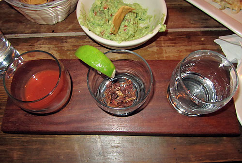 Skinny legs and all! W’burg bar serves tequila with a grasshopper chaser