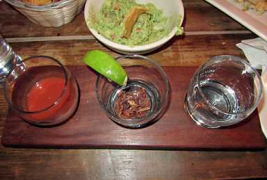 Skinny legs and all! W’burg bar serves tequila with a grasshopper chaser