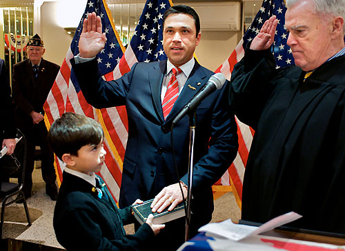 Even at swearing-in, Grimm takes some heat
