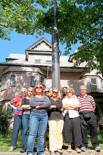 Verizon tries the grizzly bear approach to thwarting vandals — huge, ugly poles in a historic district