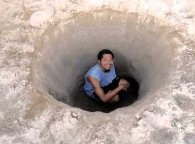 Dig it! Youths shovel their way to glory on the beach at Coney