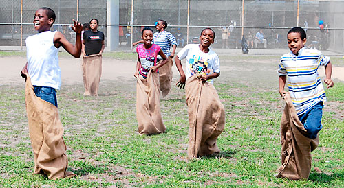 Dozens salute the summer at Paerdegat Park