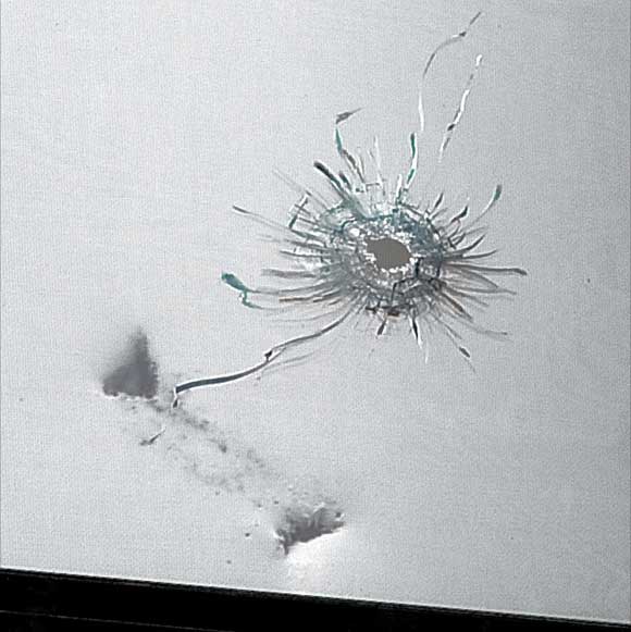 Cop fires bullet into apartment — by accident!