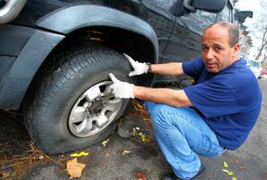 Slashed! Dozens of cars left flat in Ridge after tire shop pamphlets area