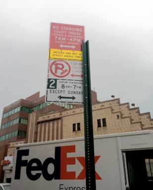 What a load! City switches out confusing street sign, but hated loading zone stays
