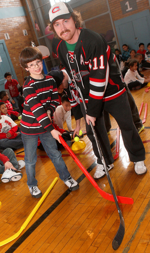 Aviators score big with visits to kids at SUNY Downstate and PS 212