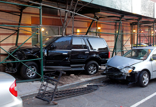 Woman injured after SUV crashes into Downtown condo