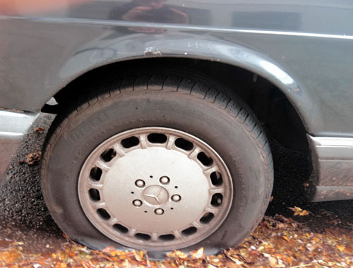 Slashed! Dozens of cars left flat in Ridge after tire shop pamphlets area