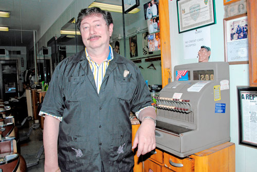 City snips barber with petty fine — over his 100-year-old cash register!