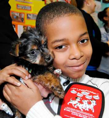 Dog-napped pup visits kids
