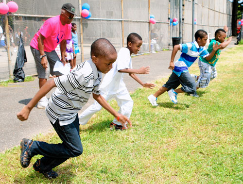 State Sen. John Sampson takes a spill during Family Day celebration