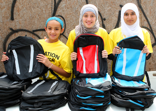 Schooled! Two mosque protestors snubbed at backpack giveaway