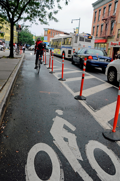 Cyclist’s makeshift bike lane barricade stops cops cars from blocking path
