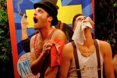 These circus performers have some snake oil to sell you