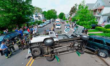 Woman trapped for 20 minutes of terror in flipped over ambulance