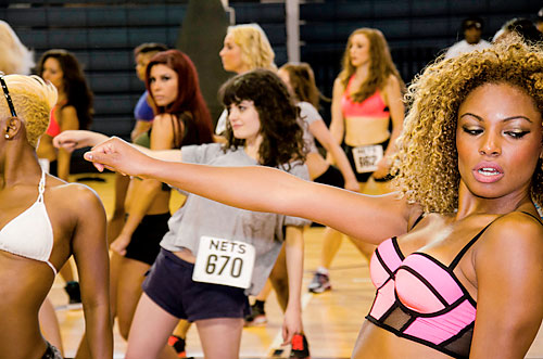 Cheers times two! Our reporter parties, then tries out for the Brooklynettes