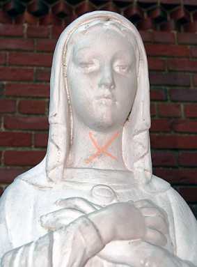 Church statues defaced