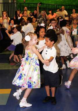 Itty bitty ballrooom: First graders waltz and salsa