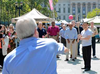 Pols play stickball at Borough Hall