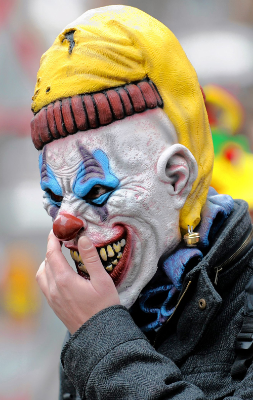 Bozos! A gun-toting trio held up an electronics store wearing clown masks: Cops