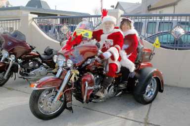 Mr. and Mrs. Claus join bikers for toy drive