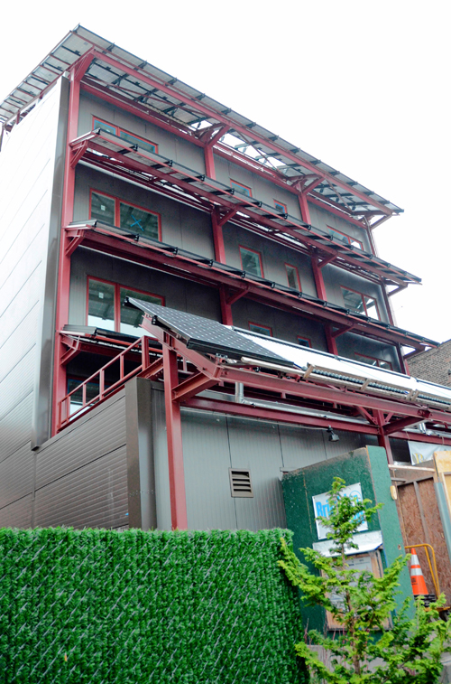 Super-green building powered by sun, wind