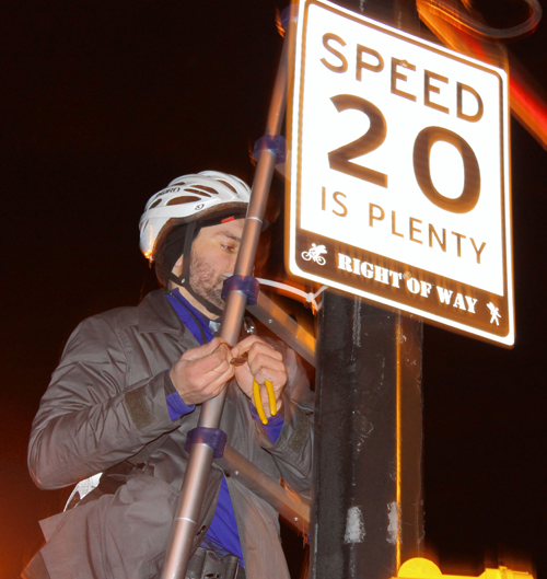 Signed up! Protesters line Prospect Park West with 20-mile-per-hour speed limit signs