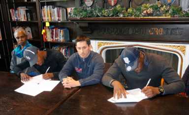 Eramus Hall signs three to Division-I schools