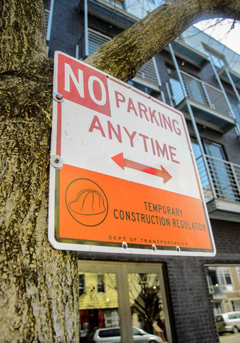 Screw job! Contractor bolts traffic signs to trees in W’burg