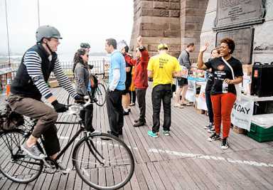 Power to the pedalers! Cyclists get surprise caffeine, carb infusion on bridge