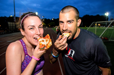 Dine and dash! Williamsburg runners scarf pizza mid-trot