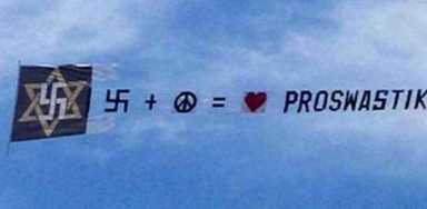 Bizarre banner flies swastika over Brighton Beach
